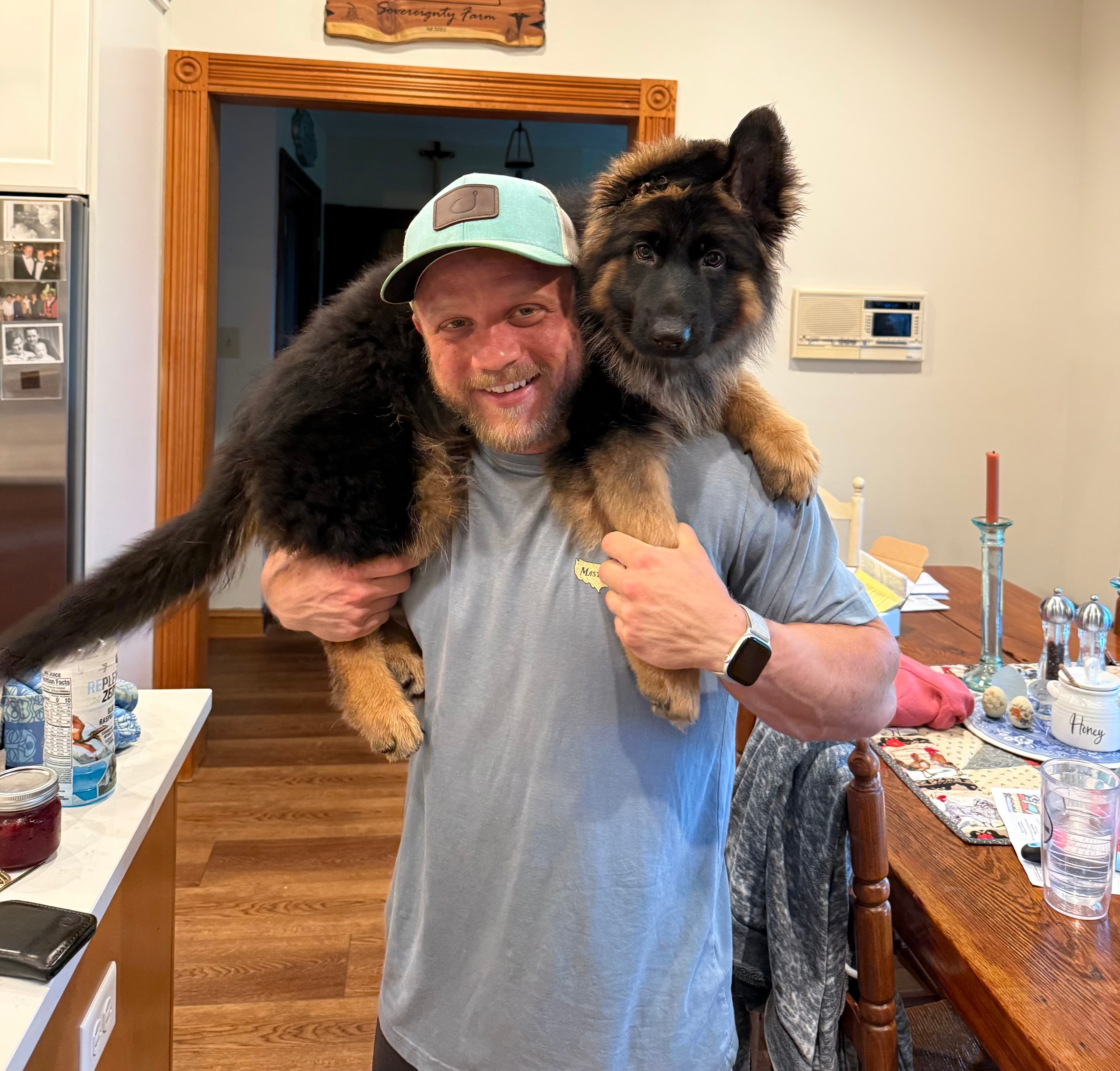 Coach posing and flexing muscles at Dawg Strength